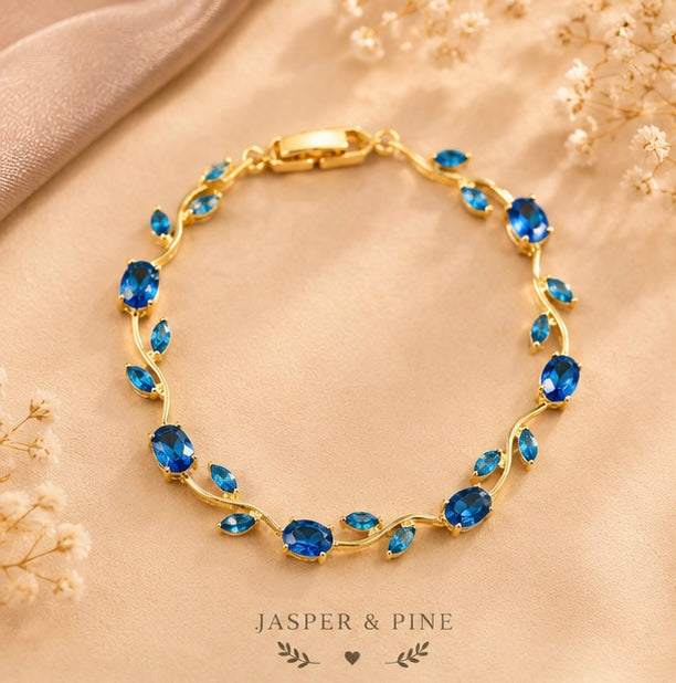 The Ocean Breeze Vine Bracelet by Jasper & Pine Co. – Gold & Sapphire Blue Crystal Floral Jewelry
