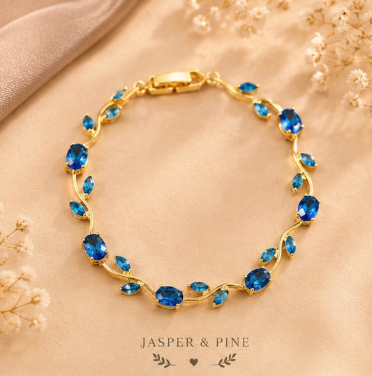 The Ocean Breeze Vine Bracelet by Jasper & Pine Co. – Gold & Sapphire Blue Crystal Floral Jewelry