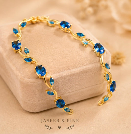 The Ocean Breeze Vine Bracelet by Jasper & Pine Co. – Gold & Sapphire Blue Crystal Floral Jewelry