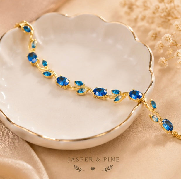 The Ocean Breeze Vine Bracelet by Jasper & Pine Co. – Gold & Sapphire Blue Crystal Floral Jewelry