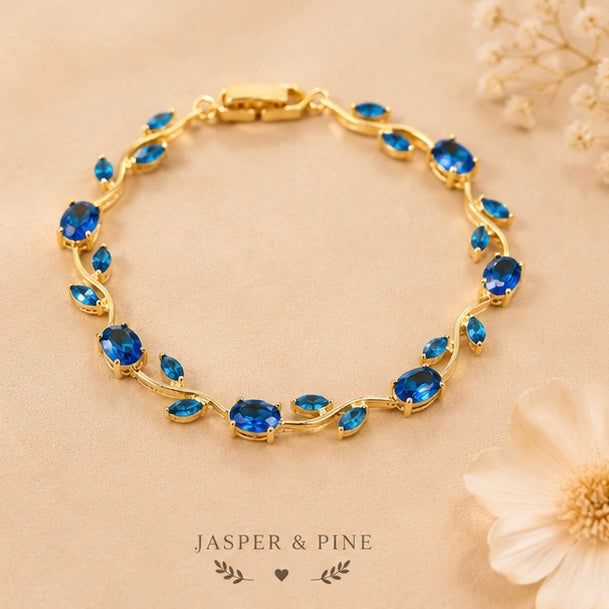 The Ocean Breeze Vine Bracelet by Jasper & Pine Co. – Gold & Sapphire Blue Crystal Floral Jewelry