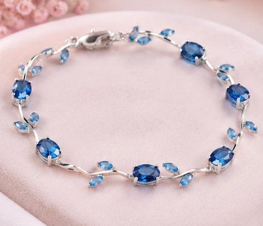 The Ocean Wave Vine Bracelet by Jasper & Pine Co. – Silver & Sapphire Blue Crystal Floral Jewelry