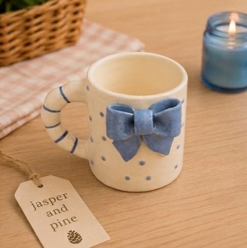 The 3D Blue Bow Ceramic Mug by Jasper & Pine Co.
